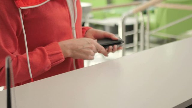 Close-up - the receptionist gives the keys on a registration stand