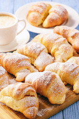 Homemade sweet croissants stuffed with cheese.