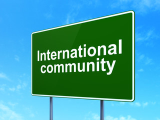 Political concept: International Community on road sign background