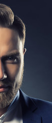 Part of face of man with hair cut and beard