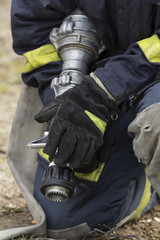 Firefighter holding fire hose