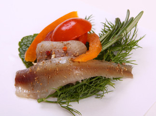 Roll with herring.Herring on pertse.esklyuziv dish of ryby.File capelin. Preservation of Herring.