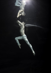 young male ballet dancer unerwater