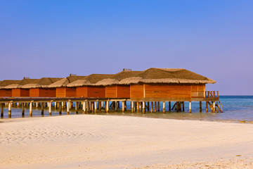 Bungalows on tropical Maldives island