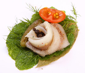Roll with herring.Herring on pertse.esklyuziv dish of ryby.File capelin. Preservation of Herring.