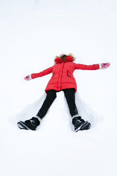 girl in a red jacket in winter