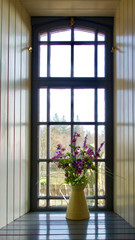 Flowers in a vase in window