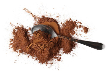 pile cocoa powder and spoon isolated on white background