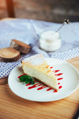 triangle cheese cakes in cafe. On a wooden table