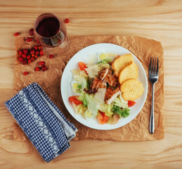 Caesar salad with croutons, quail eggs, cherry tomatoes and gril