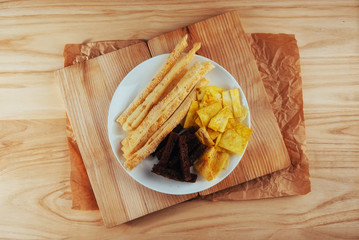 chips, crispy crackers of black bread with sesame and sticks