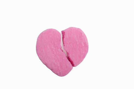 A broken pink candy heart