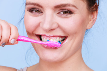 Woman brushing cleaning teeth