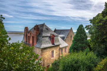 Fototapeta na wymiar Mont-Saint-Michel stone house architecture and nature, France