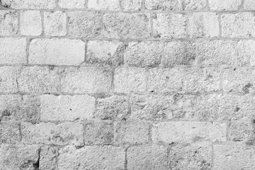 Old, aged and dirty brick wall texture in black&white.