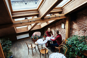 Beautiful young man and woman are celebrating Valentine day