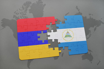 puzzle with the national flag of armenia and nicaragua on a world map