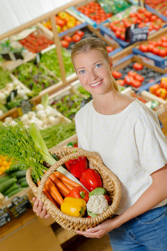 Woman by a vegetable stand