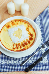 Delicious cheese casserole in a ceramic pot.