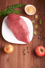 piece of meat on a wooden table