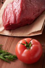 piece of meat on a wooden table