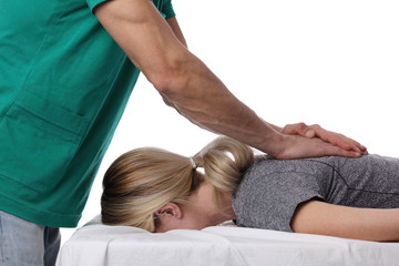 Chiropractic, osteopathy, dorsal manipulation. Therapist doing healing treatment on women's back ....