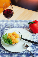 Fried cheese balls with salad and sauce