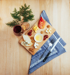 Red Wine And Assorted Cheese Plate with fruit