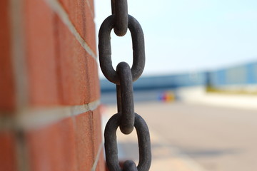 Chain next to a wall