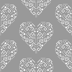 Navajo heart shape ornament seamless vector pattern. White and grey tileable aztec background.