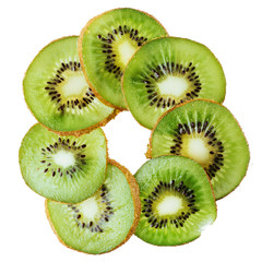 Whole kiwi fruit and his sliced segments isolated