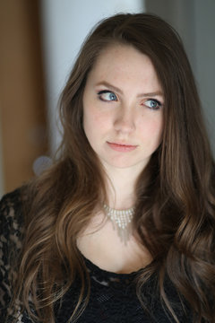 Woman With Brown Hair And Beautiful Blue Eyes