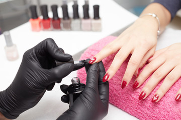 Woman having a manicure in a beauty salon