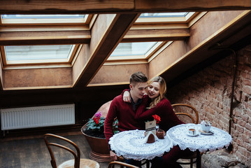 Beautiful young man and woman are celebrating Valentine day