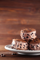 Delicious cookies with ice cream and chocolate chips on plate