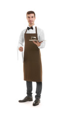 Cute waiter holding empty tray and napkin on white background