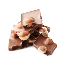 Broken chocolate pieces with hazelnut on white background