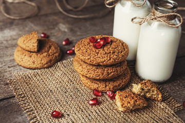 Drinking yogurt in bottles and cookies, selective focus