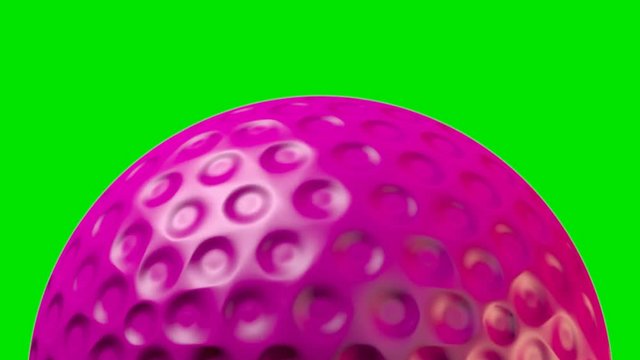 A closeup of a traditional pink lawn hockey ball with a dimpled surface rotating once to create a loop able sequence on a green screen background - 3D render