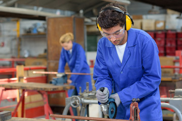 Young people at work in factory