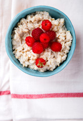Oatmeal Porridge with fresh Berries,Raspberry.Breakfast.Concept of Healthy Eating. Copy space.selective focus.