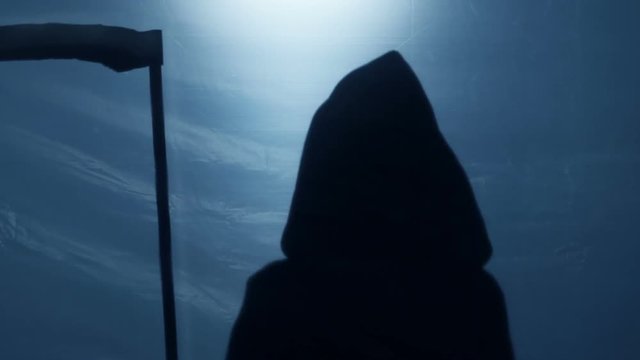 Terrible silhouette of death looking at victim, holding sharp scythe in hands
