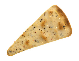 Seasoned pizza crust chip top view isolated on a white background.