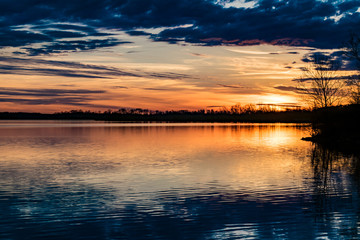 Colorful orange sunset reflected off the lake