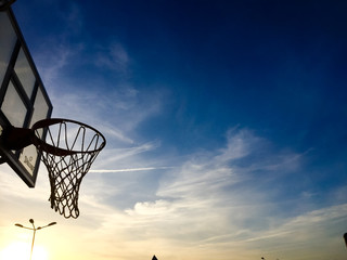 Blue sky and basketball hoop outdoors background