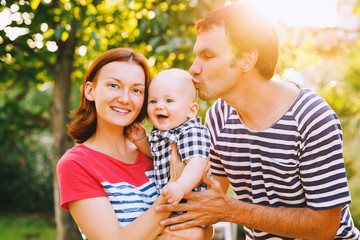 Happy family having fun and laughing on nature