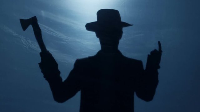 Impudent man in hat threatening with axe and making come here finger gesture