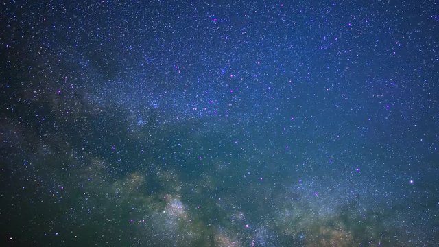 Astrophotography Time Lapse of Milky Way Galaxy Rising through Clouds -Zoom Out-