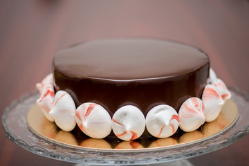 Fototapeta na wymiar Chocolate icing on a cake with .marshmallows