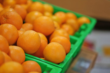 Fresh fruit in plastic boxes on market